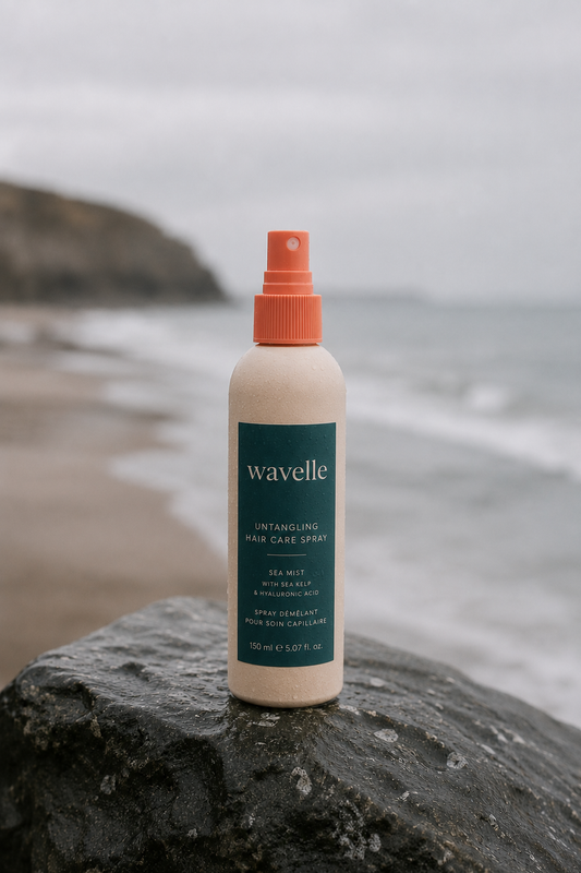 Wavelle Untangling Hair Care Spray on a coastal rock